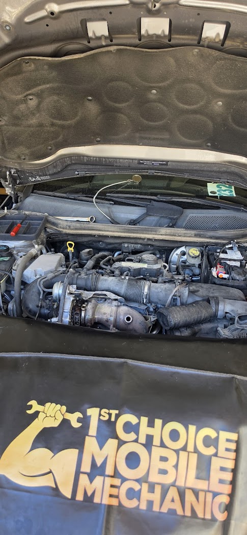 Engine work with the 1st Choice Mobile Mechanic branded cover